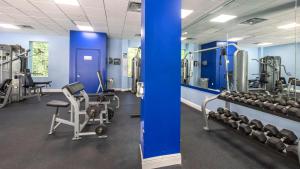a gym with several treadmills and weights at 608 Mariners Club in Key Largo