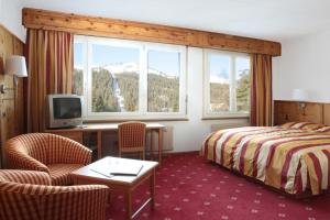 TV a/nebo společenská místnost v ubytování Grand Hôtel du Parc
