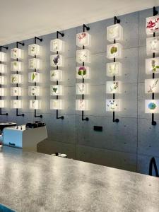 a wall with a bunch of lights on it at BaBa Boutique House Langkawi in Pantai Cenang +65 photos