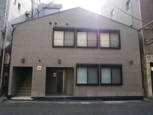 a large brick building with windows and a door at HOOD - Vacation STAY 19682v in Amami