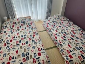 Fukuoka Condominium客房内的一张或多张床位