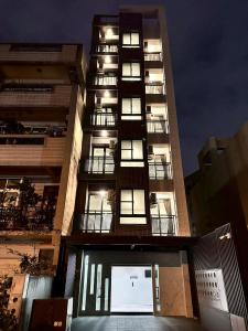 a tall building with a lot of windows at Neostay in Zhubei