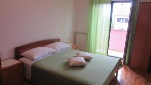 Postel nebo postele na pokoji v ubytování Apartment A&M