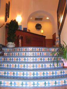 a set of stairs in a building with a stair case at Hotel Potenza in Naples