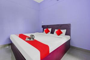 Postel nebo postele na pokoji v ubytování Collection O Clement Holydays