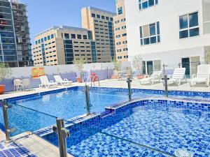 a swimming pool on the roof of a building at MK Residence JVC in Dubai