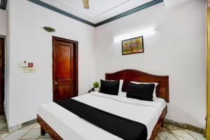 Postel nebo postele na pokoji v ubytování Hotel O Iconic Residency