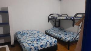 Postel nebo postele na pokoji v ubytování Hotel Guaipa Melgar + 3 fotografie