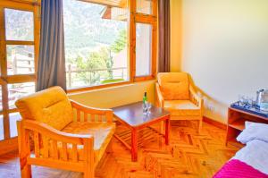 Foto sihtkohas Manāli asuva majutusasutuse !!! Hotel The Nirvana Hills By Hotel Manu !!! A Luxury Stay With Mountain View!!!Couple Friendly!!! Balcony Rooms!!!Open Terrace With 360 View!!! galeriist