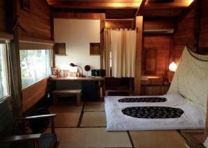 Una cama o camas en una habitación de 台南謝宅 Old House Inn