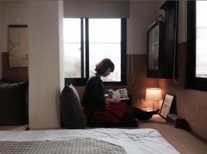 Una cama o camas en una habitación de 台南謝宅 Old House Inn