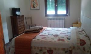 Voodi või voodid majutusasutuse Cadorna Chalet toas