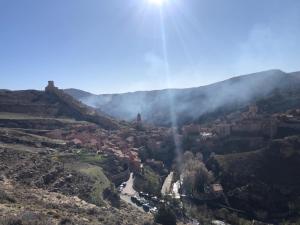 a view of a town in a mountain valley at casa bilborazin in Albarracín +2 photos