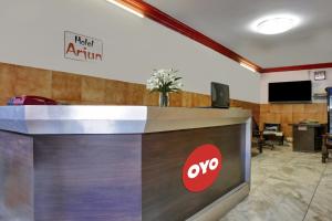 an office with a sign that says top atrium at Hotel O Arjun in Prayagraj