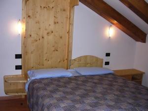 Postel nebo postele na pokoji v ubytování Maso La Vecchia Quercia