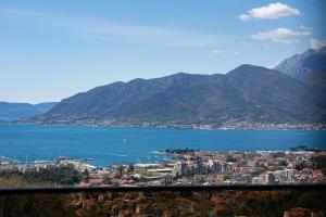 a view of a city and a body of water at Barber Apartment in Tivat