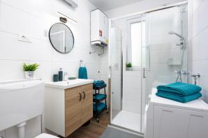 Koupelna v ubytování DV Apartment + 33 fotografií