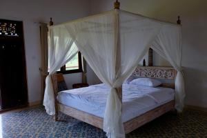 Postel nebo postele na pokoji v ubytování Hideaway House Bali + 19 fotografií