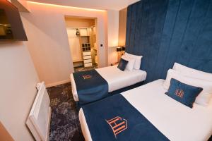 Postel nebo postele na pokoji v ubytování Hotel Ideja