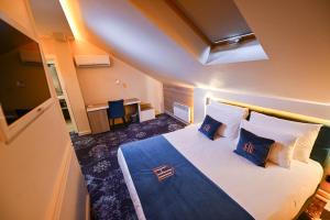 Postel nebo postele na pokoji v ubytování Hotel Ideja