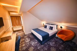 Postel nebo postele na pokoji v ubytování Hotel Ideja