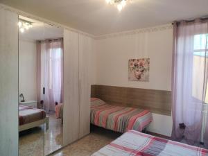 Ένα ή περισσότερα κρεβάτια σε δωμάτιο στο Henson appartamento