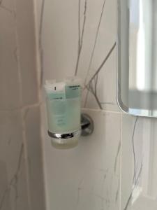 a bathroom with a soap dispenser on a wall at Rum Star Desert Camp in Wadi Rum