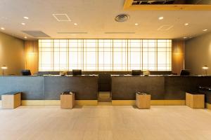 a lobby with a waiting room with a large window at Shinjuku Washington Hotel in Tokyo