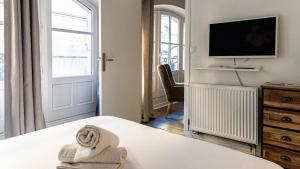 Posteľ alebo postele v izbe v ubytovaní L'Escapade Urbaine - Cosy et central