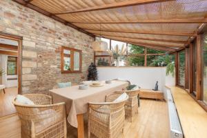 a dining room with a table and chairs at Beautiful Cottage nr Mendip Hills Private Parking in Chilcompton