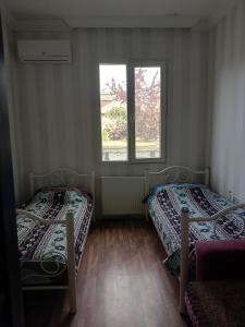 Postel nebo postele na pokoji v ubytování Jesis Batumi