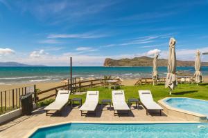 a resort with a swimming pool and the beach at Elia Agia Marina Hotel in Agia Marina Nea Kydonias