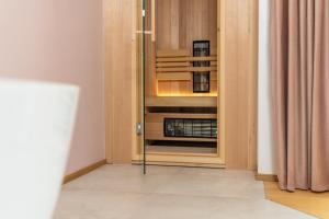 an empty cabinet in a room with a curtain at Landhouse Bled - Adults Only in Bled