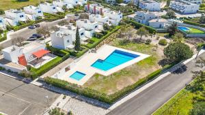 an aerial view of a house with a swimming pool at HideAway by MOJE Holiday in Porches