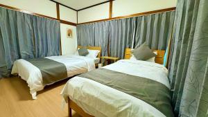 En eller flere senge i et værelse på 嵐-池袋4分新宿15分