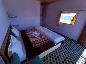 Voodi või voodid majutusasutuse Native Retreat Cottage Lukung toas
