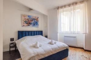 Giường trong phòng chung tại 4-room city center apartment - L'Atmosphère Balnéo