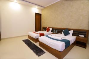 Postel nebo postele na pokoji v ubytování Hotel Luxe Stay Near Delhi Airport