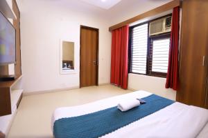 Postel nebo postele na pokoji v ubytování Hotel Luxe Stay Near Delhi Airport
