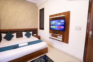Postel nebo postele na pokoji v ubytování Hotel Luxe Stay Near Delhi Airport