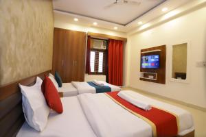Postel nebo postele na pokoji v ubytování Hotel Luxe Stay Near Delhi Airport