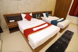 Postel nebo postele na pokoji v ubytování Hotel Luxe Stay Near Delhi Airport