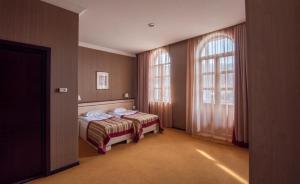 Postel nebo postele na pokoji v ubytování Hotel Rike park + 37 fotografií