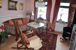 Posezení v ubytování Christianshus Ferienhaus Vareler Hafen