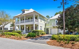 a large white house with a porch at WaterColor Escape in Santa Rosa Beach