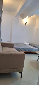 Ένα ή περισσότερα κρεβάτια σε δωμάτιο στο Citrus Studio a Cozy Nest