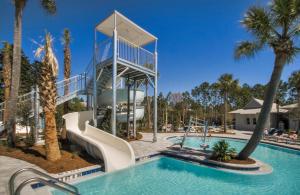 a resort with a pool and a water slide at WaterColor Escape in Santa Rosa Beach