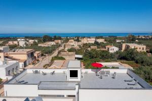 a view from the roof of a house with a patio at Case Vacanza Loria in Castelluzzo