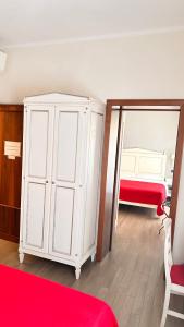 Postel nebo postele na pokoji v ubytování Notti sull'Adige