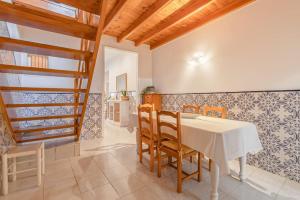 a dining room with a white table and chairs at 4-bedroom Townhouse with Terrace in Center Oldtown in Lagos